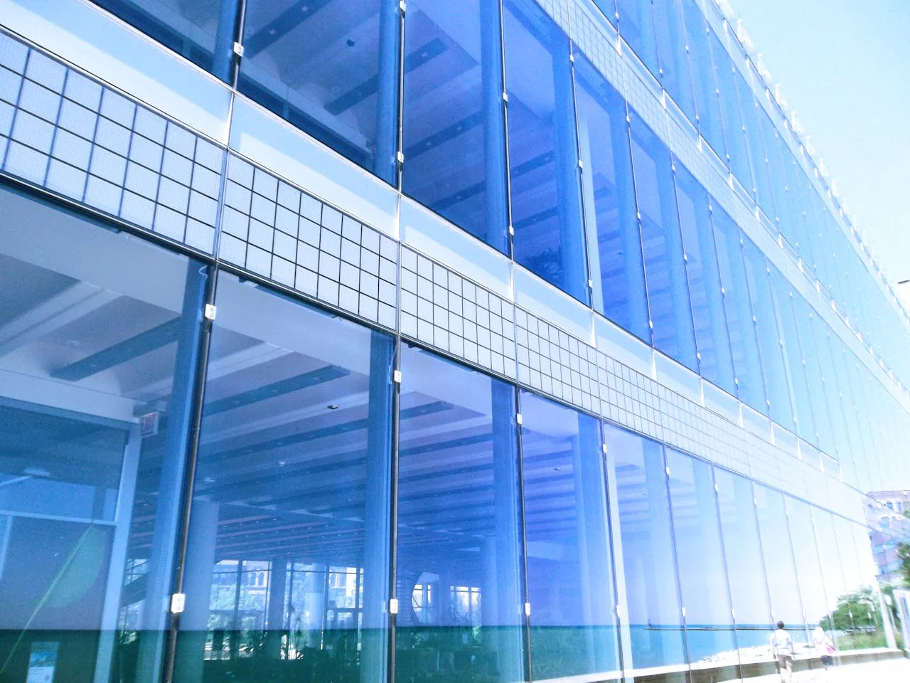 Illustrative glazed commercial building; not a named West Lakes customer property