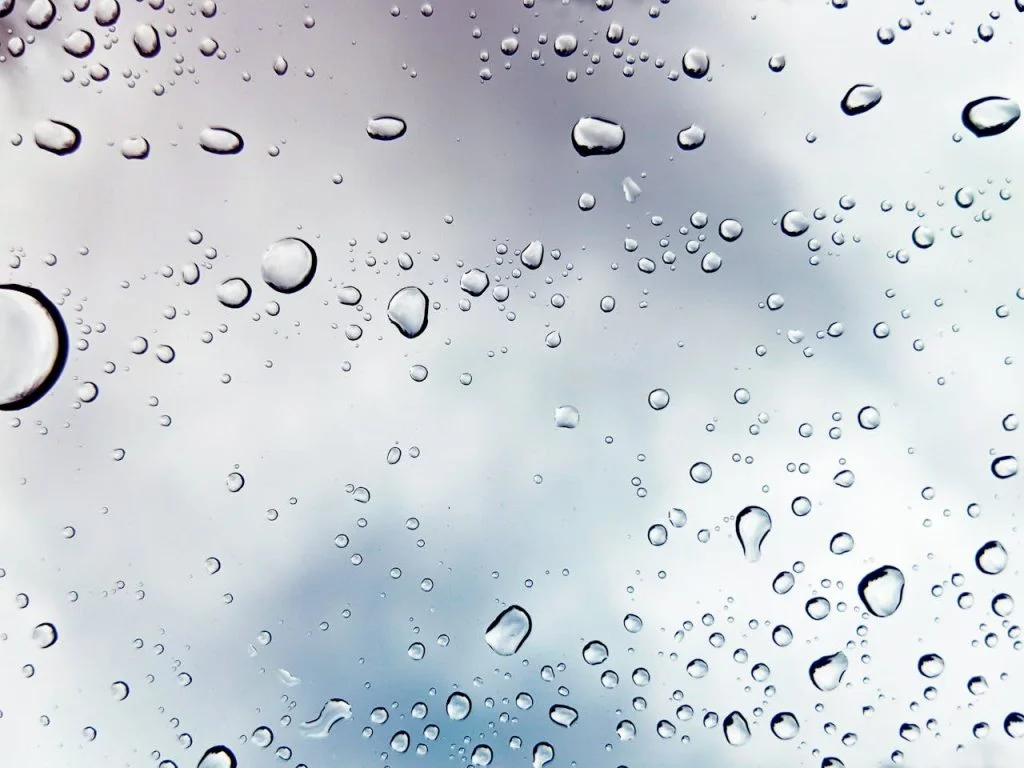 Illustrative close-up of water droplets on glass; not a West Lakes customer property